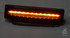 LEDSON Lampe fr Scania Sonnenblende, mit leuchtender orangefarbener LED-Leiste in dunklem Gehuse.