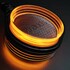 Strands Spiegelleuchte "FOR9T" mit orangefarbenem Licht und schwarzem Geh�use.