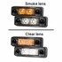 Zwei LKW Positionsleuchten mit Rauchglaslinse, eine mit orangem, die andere mit wei�em Licht.